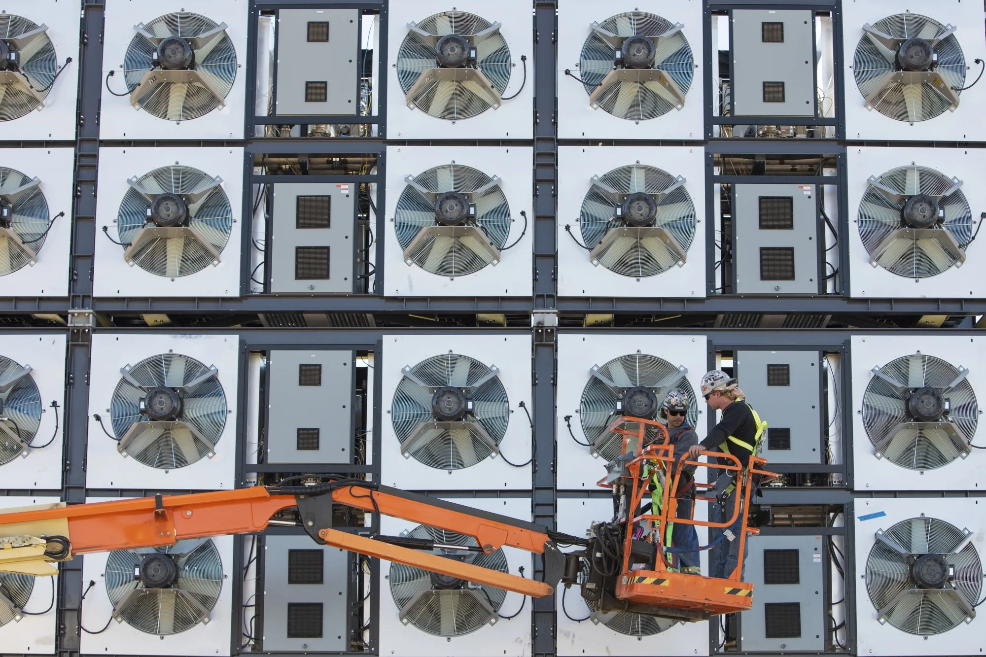 Crew work to finish construction on CarbonCapture Inc.’s direct air capture system.