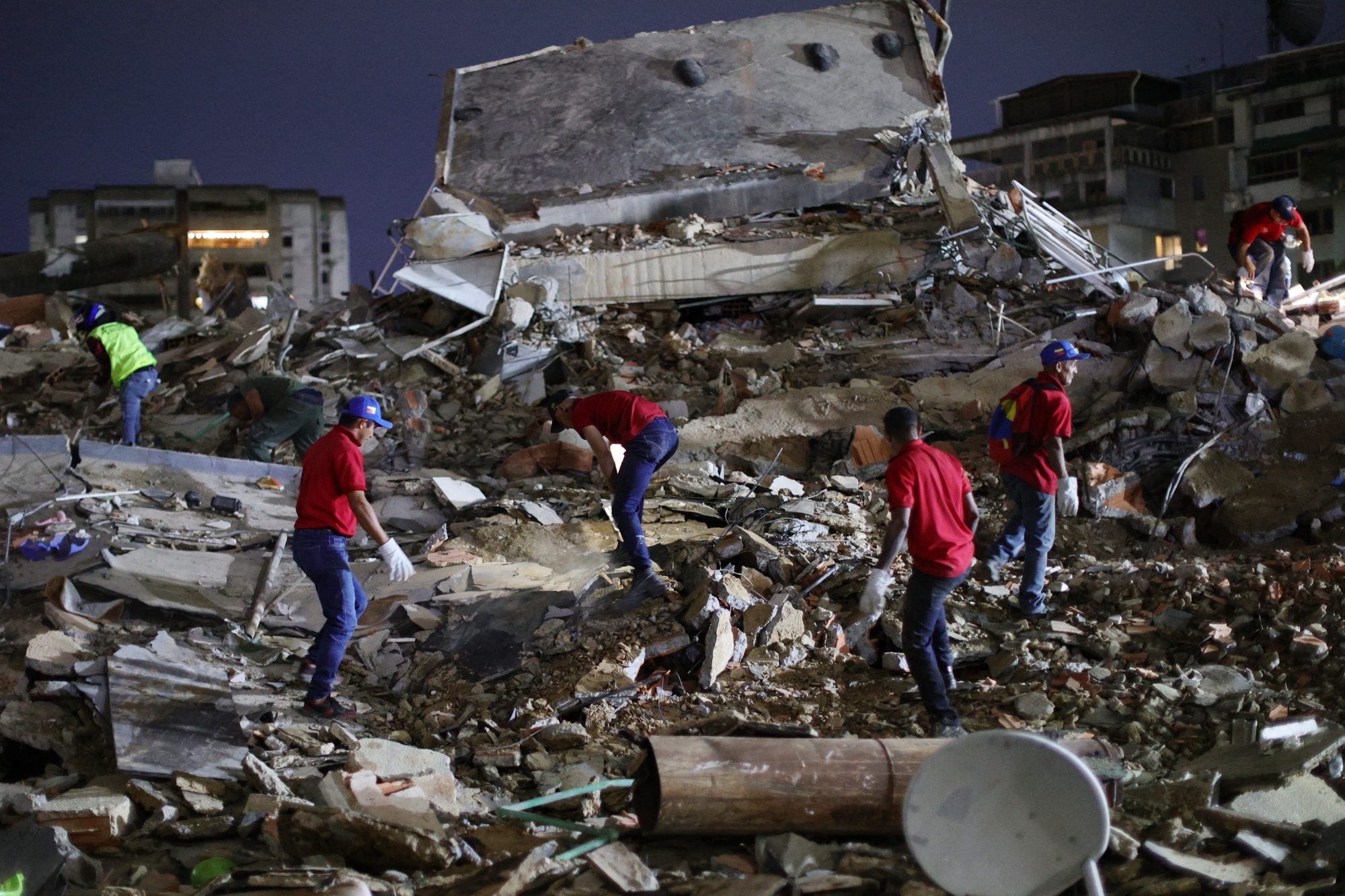 Rescue workers search for survivors.