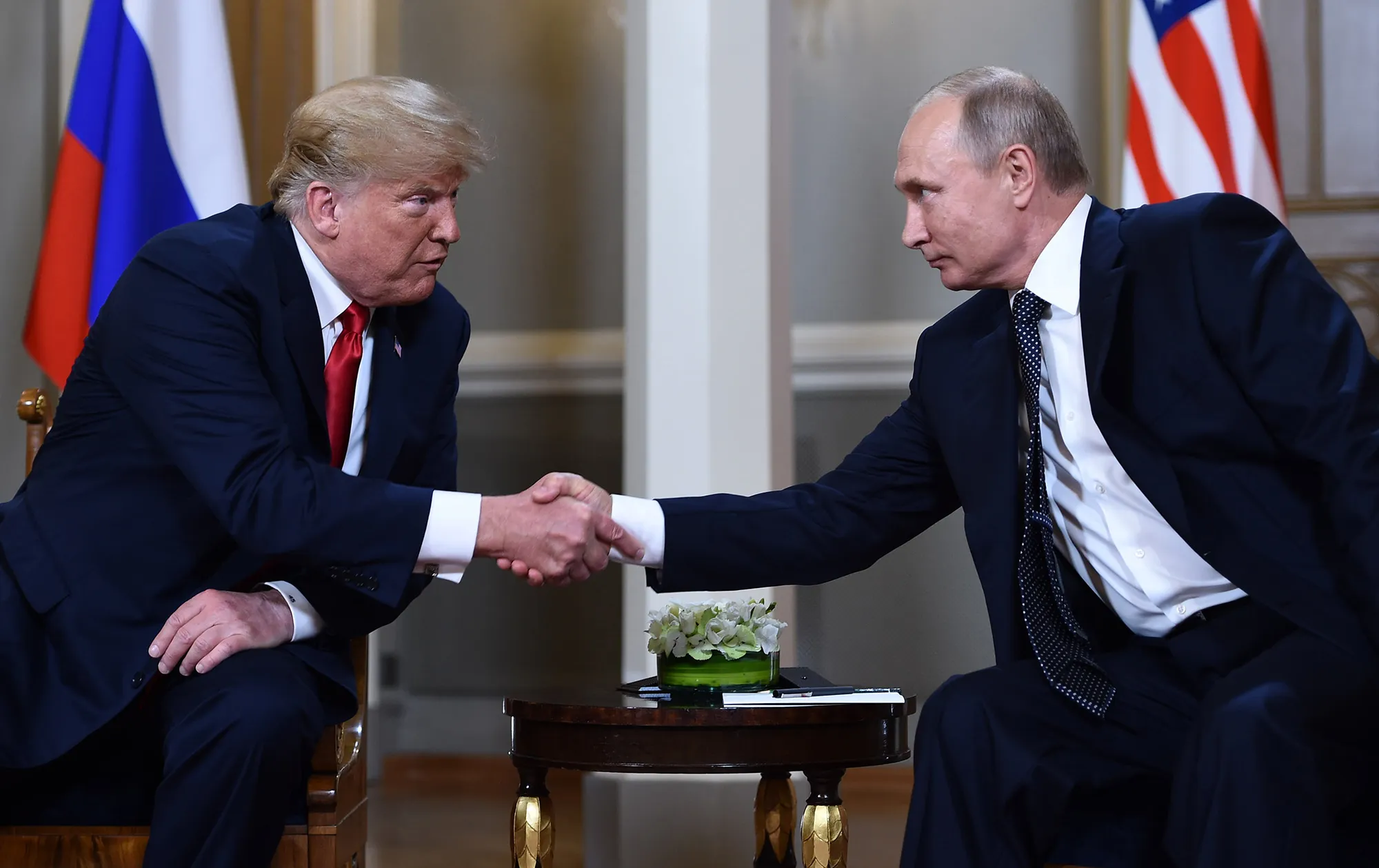 Vladimir Putin, right, and&nbsp;Donald Trump shake hands&nbsp;in Helsinki, on July 16, 2018.&nbsp;