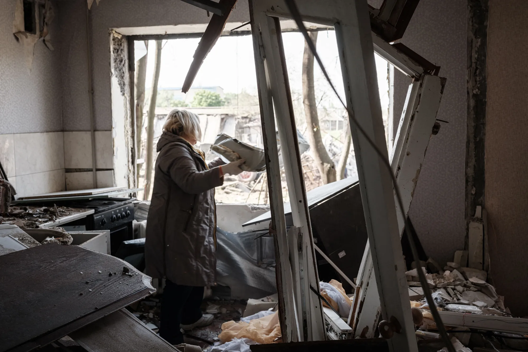 A resident clears debris from a damaged&nbsp;apartment following a Russian strike&nbsp;in Kramatorsk,&nbsp;eastern Ukraine, on May 5.