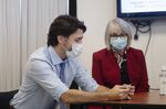 Justin Trudeau and Patty Hajdu observe vaccinations against Covid-19 at an Ottawa hospital on Dec. 15.