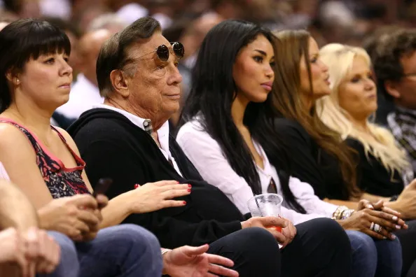 Donald Sterling and V. Stiviano having a silent moment.&nbsp;Photographer: Ronald Martinez/Getty Images