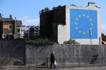 A mural by street artist Banksy depicting a EU&nbsp;flag being chiseled by a workman covers the side of a building in Dover.