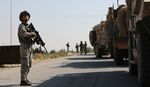 Turkish soldiers patrol the northern Syrian Kurdish town of Tal Abyad, on the border between Syria and Turkey, on Oct. 23.