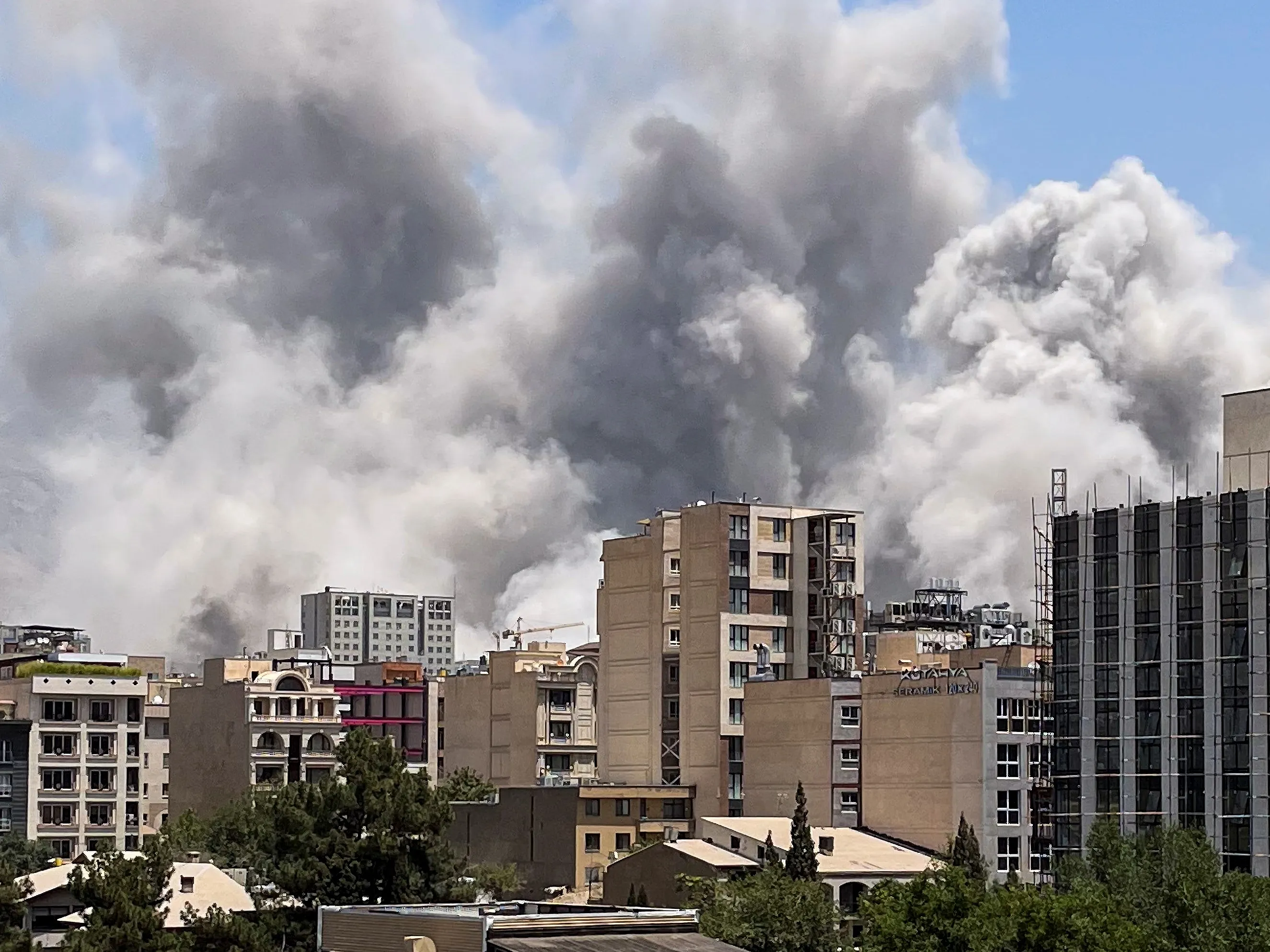 Smoke rises from a location allegedly IRGC's Sarallah Headquarters in north of Tehran after being targeted by Israel on June 23.