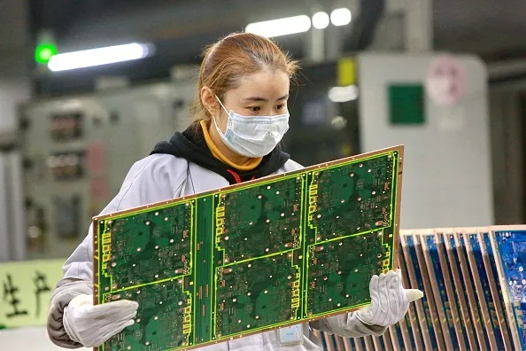 Back to work at a Taiwanese-owned factory in China.