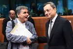 Greece's Finance Minister Euclid Tsakalotos, left, speaks with European Central Bank President Mario Draghi during a Euro group finance ministers meeting on May 22, in Brussels.
