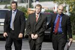 In this Aug. 29, 2007, file photo, Britt Reid is escorted into the Montgomery County district court house in Conshohocken, Pa. Former Kansas City Chiefs assistant coach Britt Reid is scheduled to enter a guilty plea to felony driving while intoxicated related to a car crash that seriously injured a young girl. Jackson County Circuit Court online records show Reid, the son of Chiefs coach Andy Reid, is scheduled to plead guilty on Monday, Sept. 12, 2022.  (AP Photo/Matt Rourke, File)