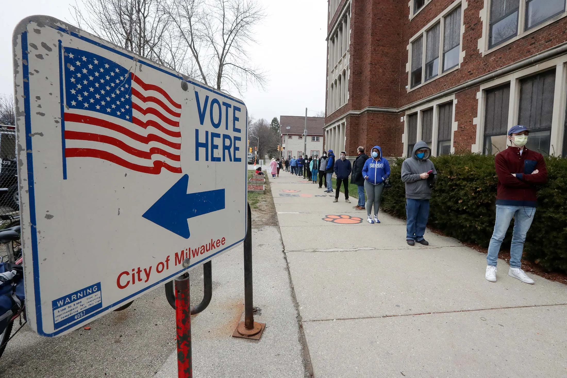 Voters line up at Milwaukee’s Riverside High School for Wisconsin’s primary election on April 7.&nbsp;
