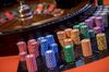 Gaming chips sit stacked next to a roulette wheel at the Global Gaming Expo Asia (G2E Asia) in Macau, China, on Tuesday, May 21, 2019. The expo runs through May 23.
