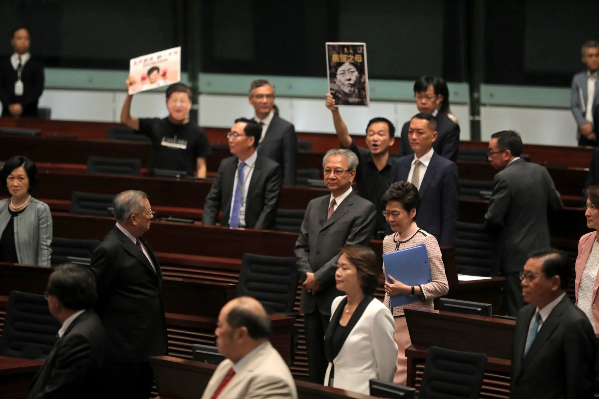 Carrie Lam walks into the chamber on Oct. 16.