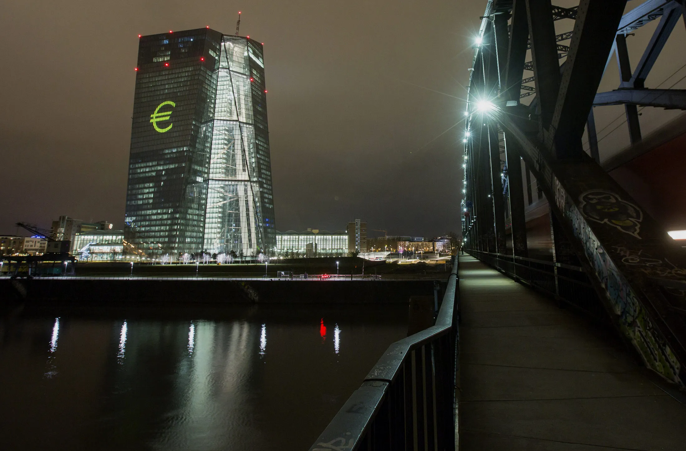 An illuminated euro currency symbol is projected on to the European Central Bank (ECB) headquarters&nbsp;in Frankfurt.