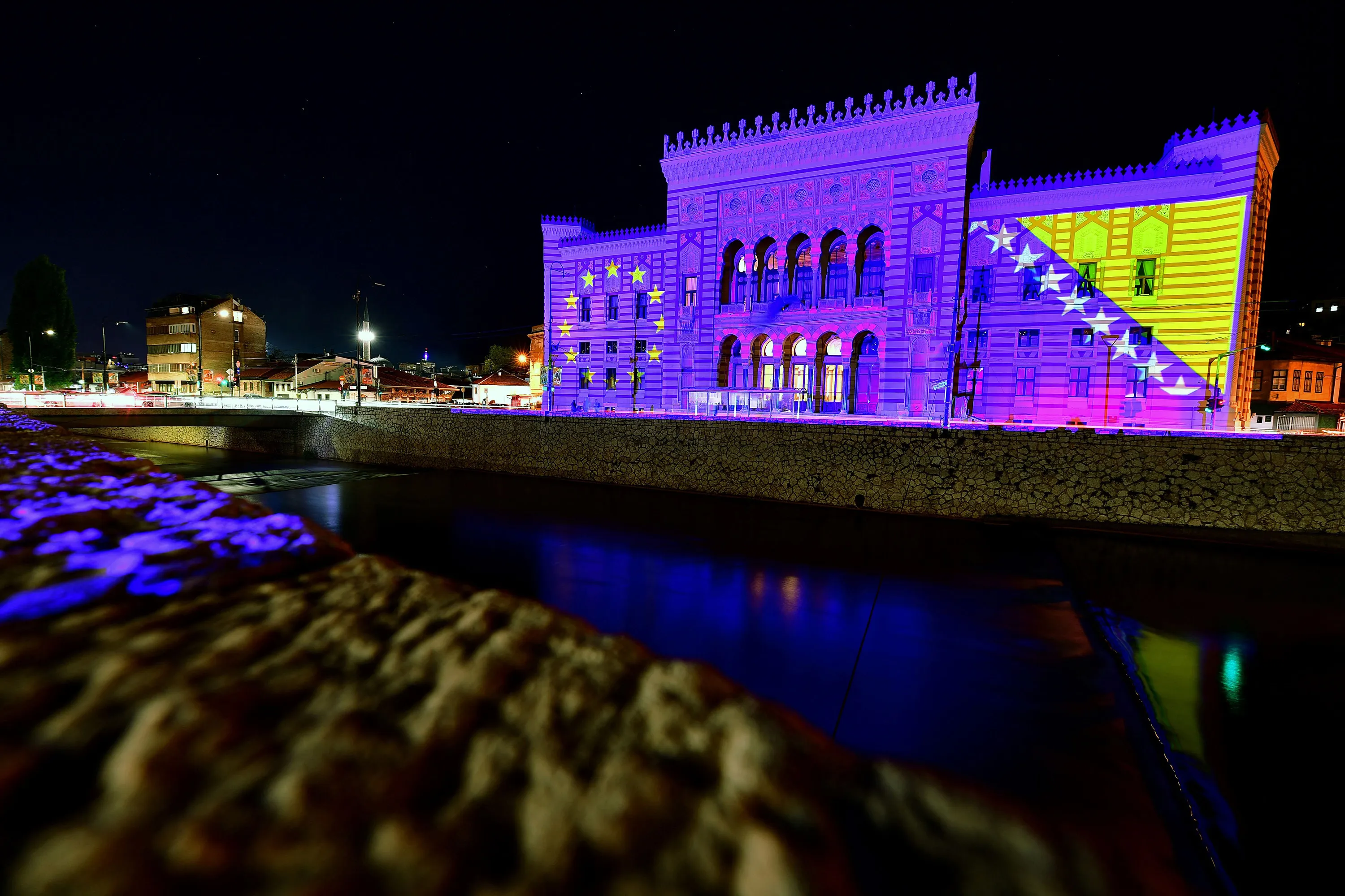 Sarajevo's City Hall illuminated with the colours of the flags of European Union and Bosnia-Herzegovina, in May.
