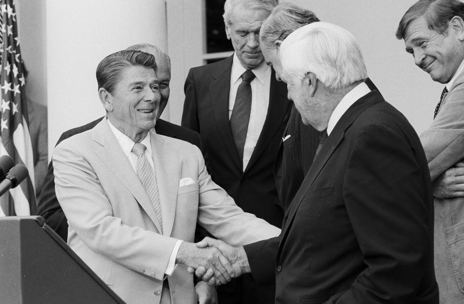 President Reagan shakes hands with House Speaker Tip O'Neill in August 1982; by year's end the White House and Congress would agree to a 5-cent gas tax hike.