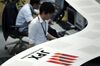 Employees work on the trading floor of the Tokyo Stock Exchange .