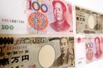 Chinese renminbi and Japanese yen bank notes.