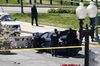 U.S. Capitol Police officers stand near a car that crashed into a barrier on Capitol Hill in Washington, on April 2.