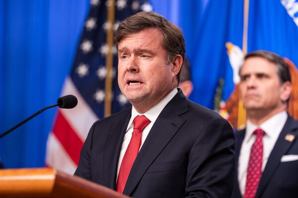 Department Of Justice And International Law Enforcement Hold News Conference