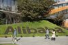 Employees walk through the campus at the Alibaba Group Holding Ltd. headquarters during the annual November 11 Singles' Day online shopping event in Hangzhou, China, on Monday, Nov. 11, 2019. Alibaba's Singles' Day shopping bonanza got off to a scorching start, logging more than 114 billion yuan ($16.3 billion) of purchases in less than 90 minutes, the equivalent of more than half of last year’s record haul for the 24-hour event.