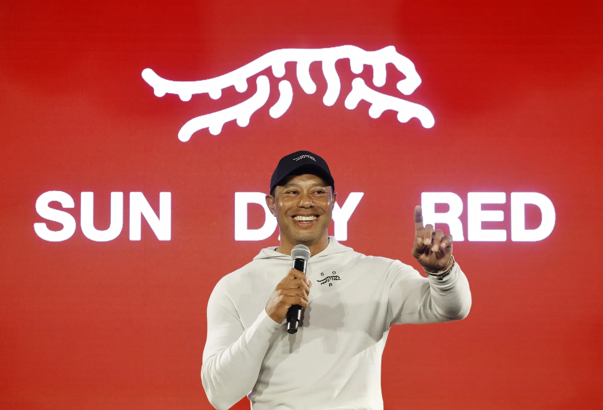 Tiger Woods speaks during the launch of&nbsp;Sun Day Red.