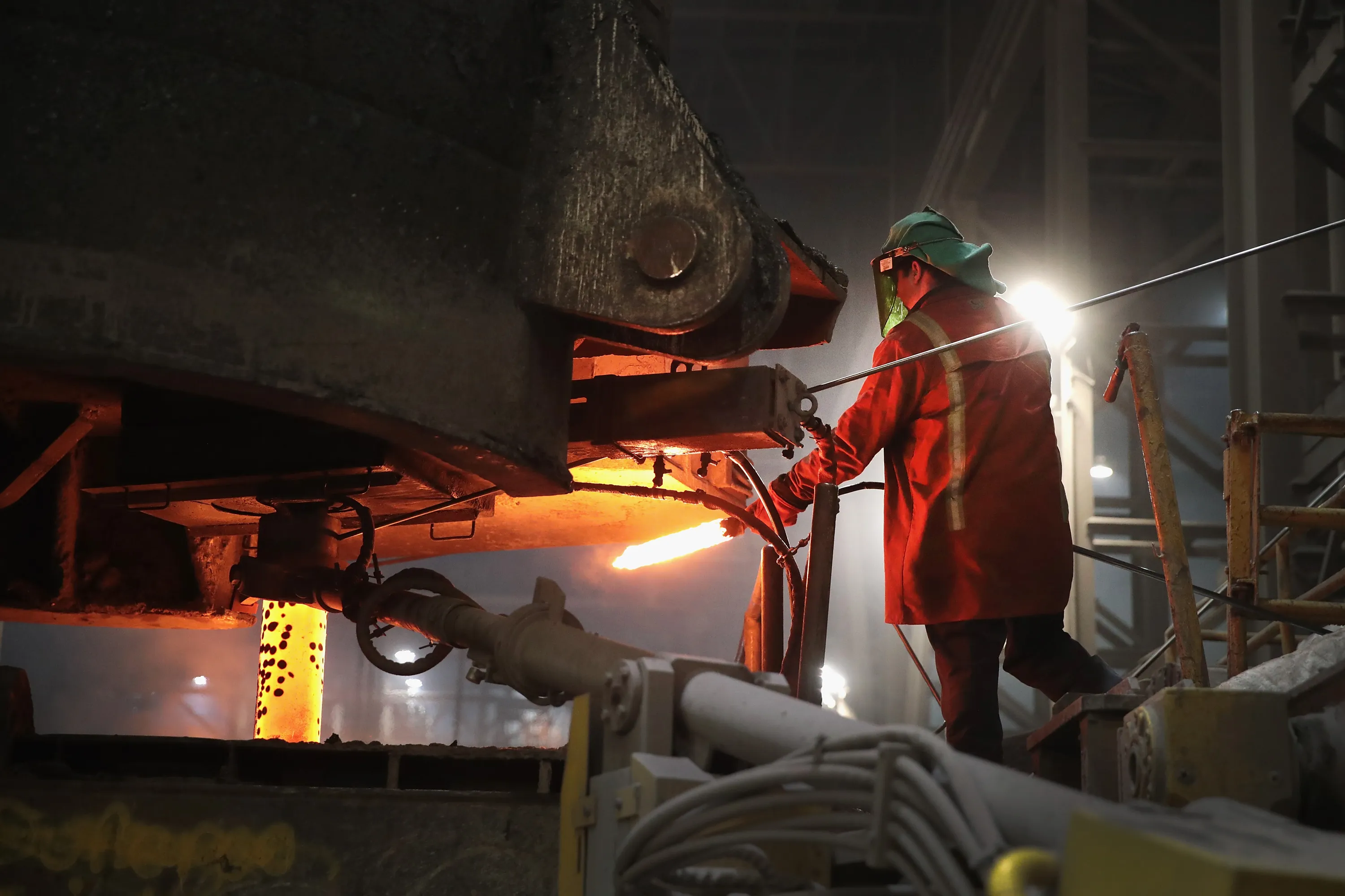 A worker checks molten steel at a steel mill&nbsp;in Portage, Indiana.&nbsp;