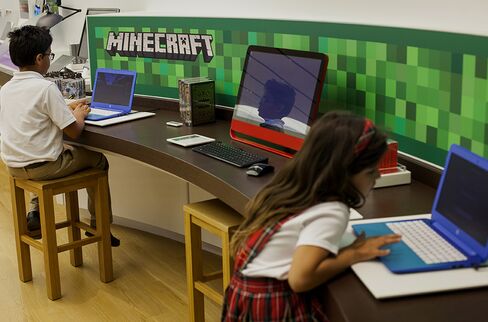 Children play the Minecraft video game at a Microsoft store in Bellevue, Washington, U.S.