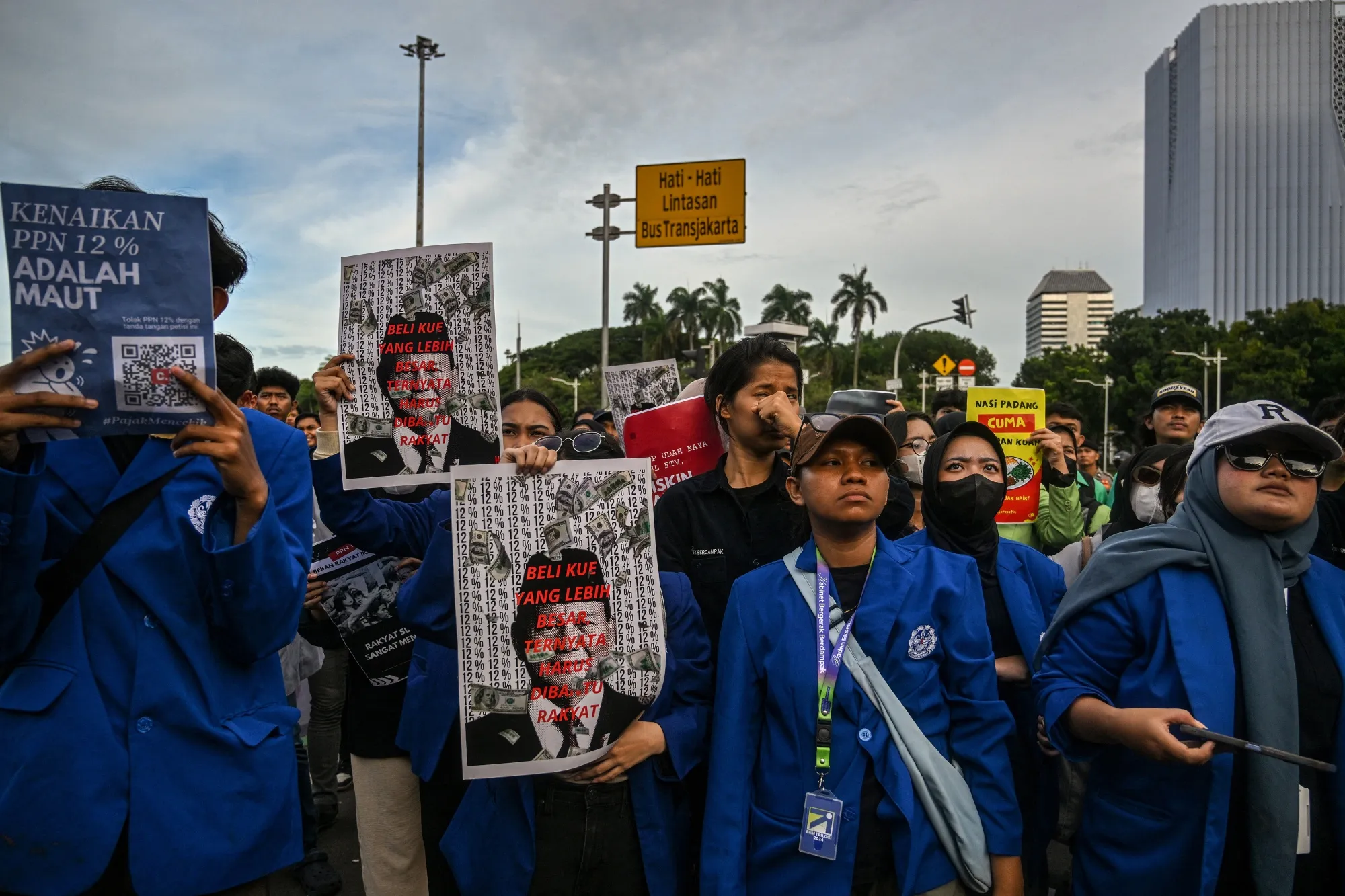 Protestors demonstrate against the VAT increase in Jakarta, on Dec. 26.