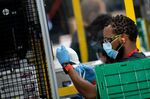 A worker at a Honeywell International Inc. factory works on N95 masks May 5, 2020, in Phoenix, Arizona.