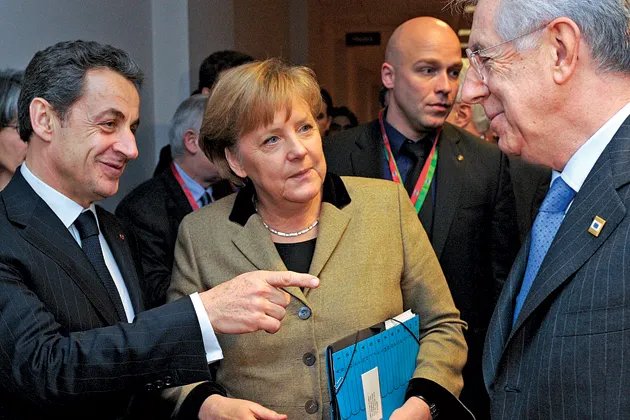 Monti, right, greets Merkel and Sarkozy at a Jan. 30 meeting in Brussels