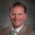 Headshot of James G Koman