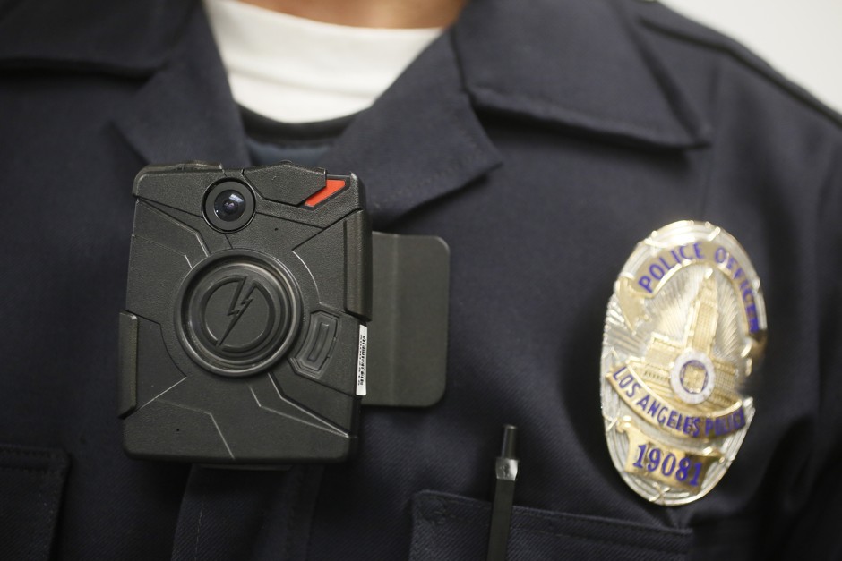 A Los Angeles Police officer wears an on-body cameras during a demonstration for media in January, 2014