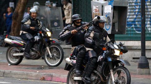 Police fire rubber bullets at opposition demonstrators in Caracas, Venezuela, on Feb. 12, 2015.