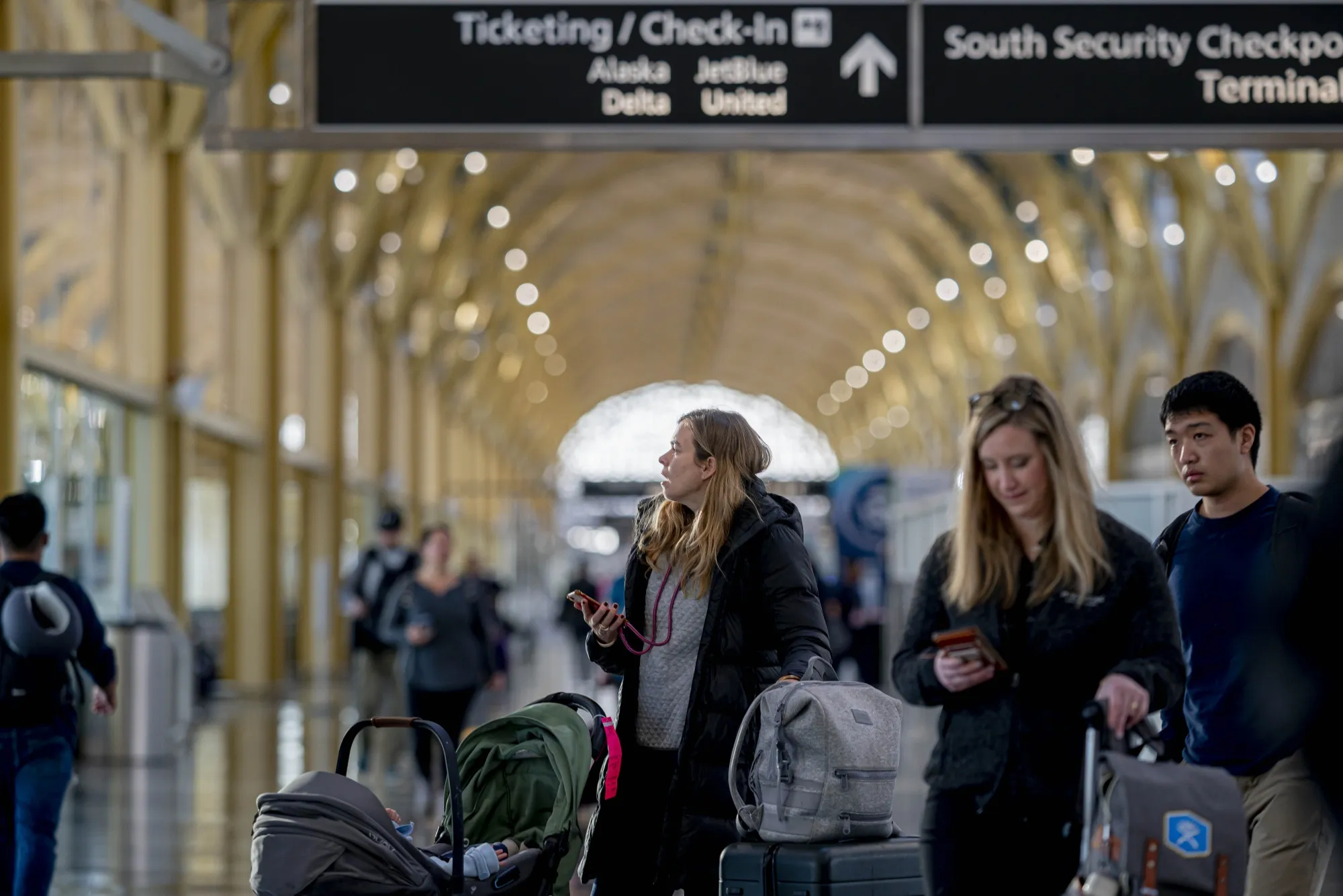Travelers check flight their flight status as flights are cancelled at Ronald Reagan National Airport&nbsp;in Arlington, Virginia, on&nbsp;Jan. 11.