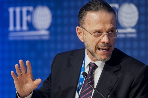 Luciano Coutinho, president of the Brazil National Development Bank (BNDES), speaks during the Institute of International Finance Annual Membership Meeting in Washington, D.C., U.S., on Friday, Oct. 11, 2013. The meeting will provide an overview and several perspectives on the macroeconomic environment as well as the prospects ahead for the global economy. Photographer: Pete Marovich/Bloomberg *** Local Caption *** Luciano Coutinho