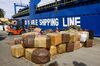 Cargo packages at God Is Able Shipping being loaded onto a boat bound for Haiti.