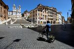 A cyclist stops near the Spanish Steps in Rome on May 4.