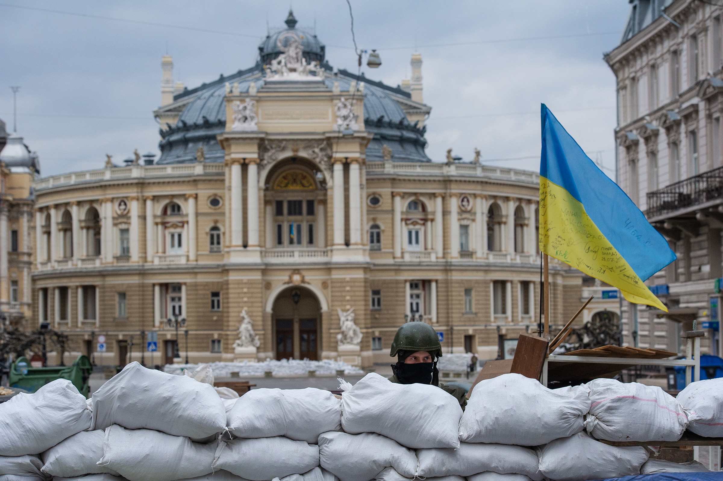 A soldier stands guard over the Odessa Opera and Ballet Theater.