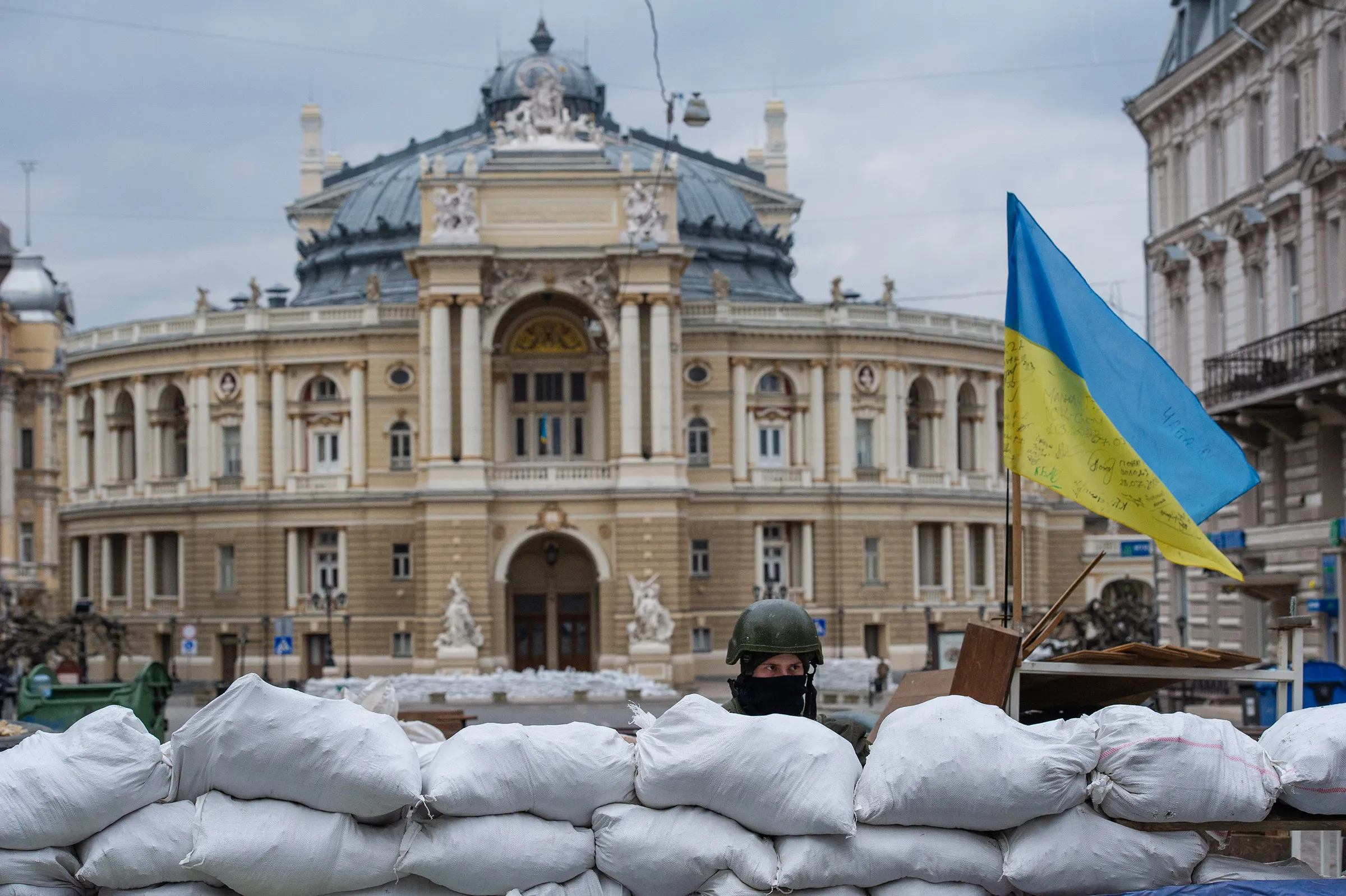 A soldier stands guard over the Odessa Opera and Ballet Theater.