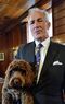 Jeremy King with his dog Teddy, a Cockapoo.