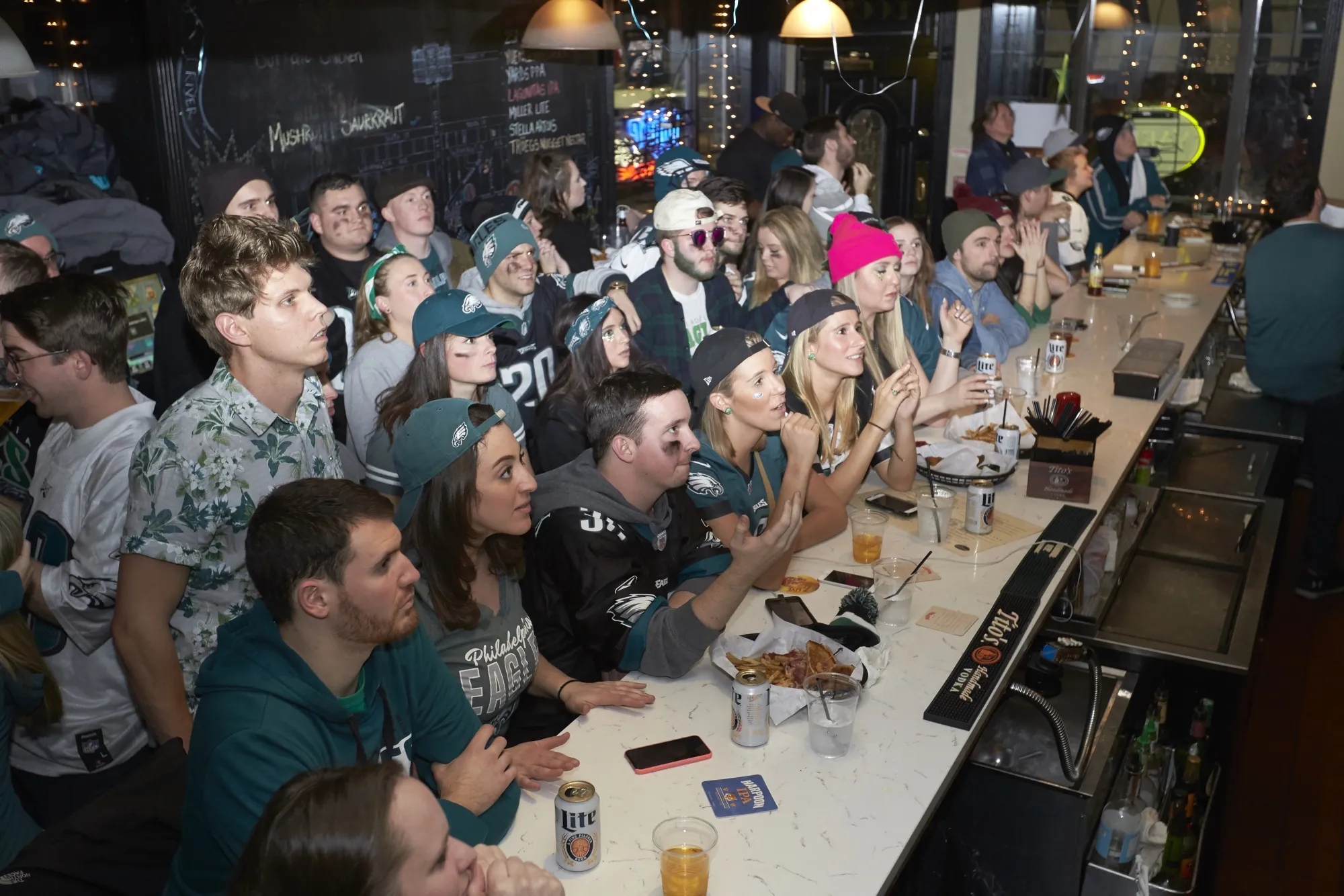 Philadelphia Eagles fans watch a game in a bar in Philadelphia.