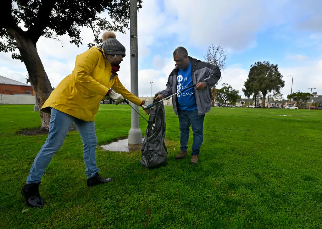 Cheryl and Rene Justin volunteered to clean up MacArthur Park during MLK Day of Service in Long Beach on Jan. 16, 2023.&nbsp;