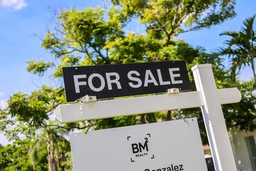 A "For Sale" sign outside a home in the Miami Shores neighborhood of Miami. 