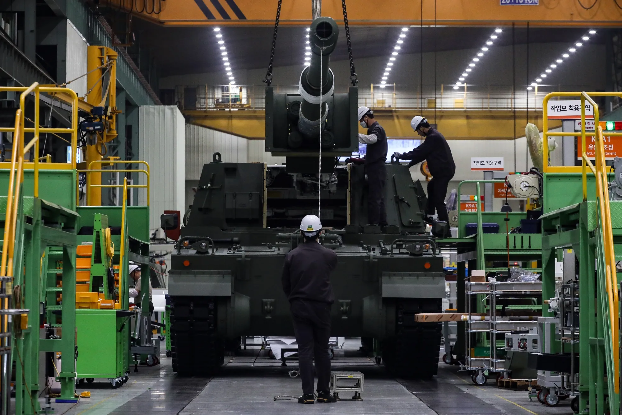Workers on the assembly line at Hanwha Aerospace Co.