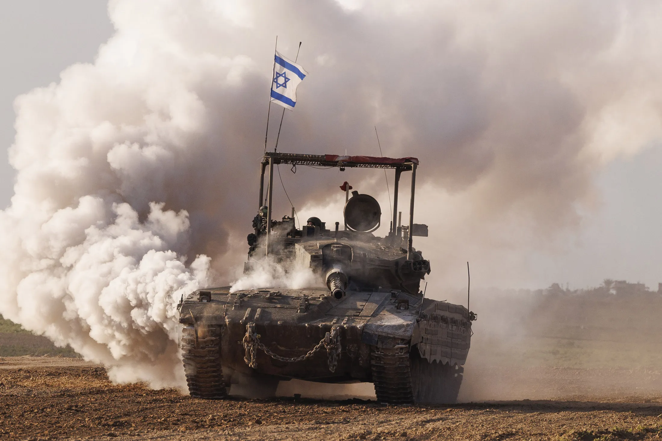 An Israeli tank travels towards Gaza, near the Israel-Gaza border in southern Israel, on&nbsp;Jan. 24.