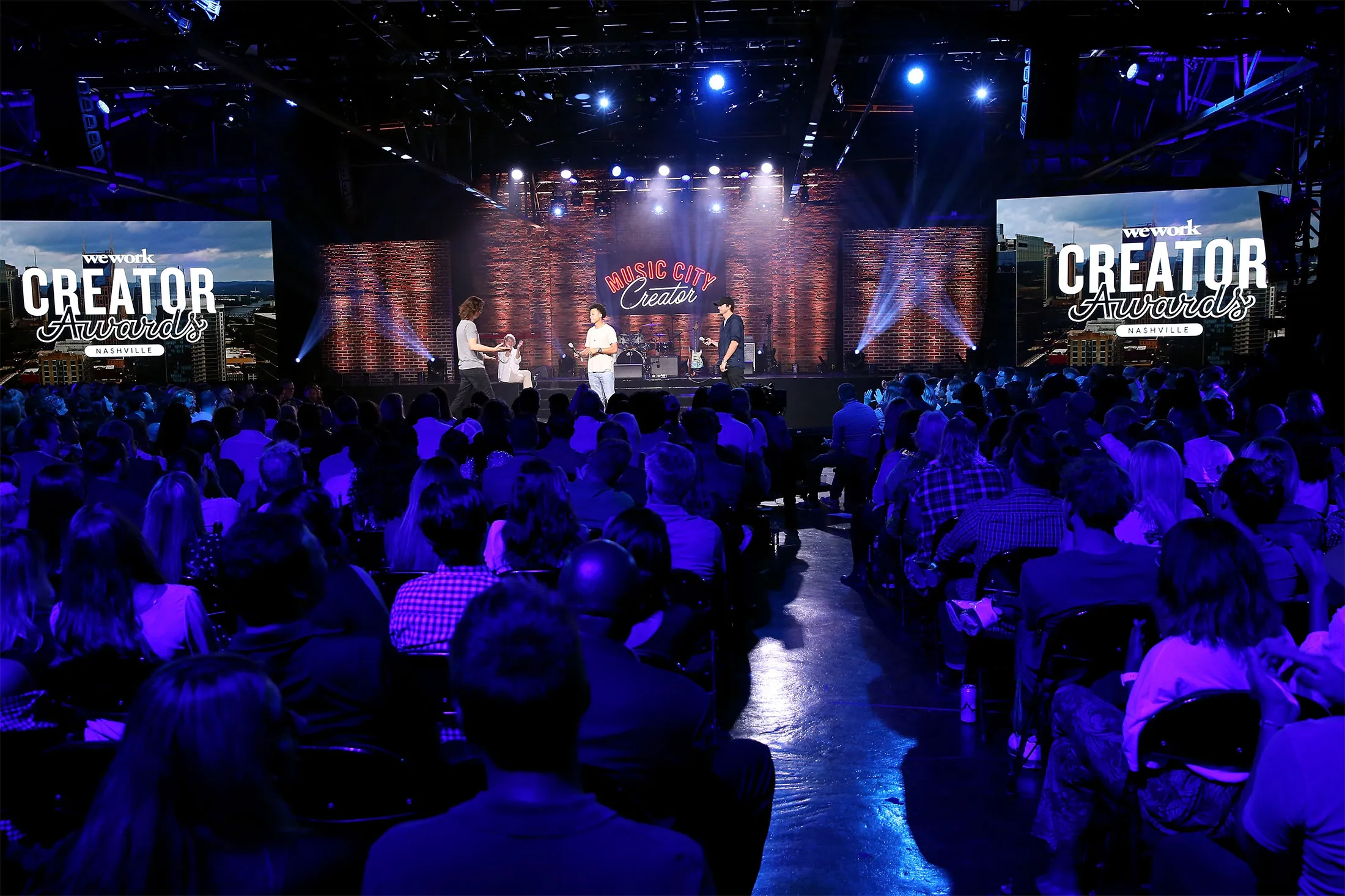 Adam Neumann CEO of WeWork and Ashton Kutcher speak onstage during Nashville Creator Awards hosted by WeWork at Marathon Music Works on September 13, 2018 in Nashville, Tennessee.&nbsp;
