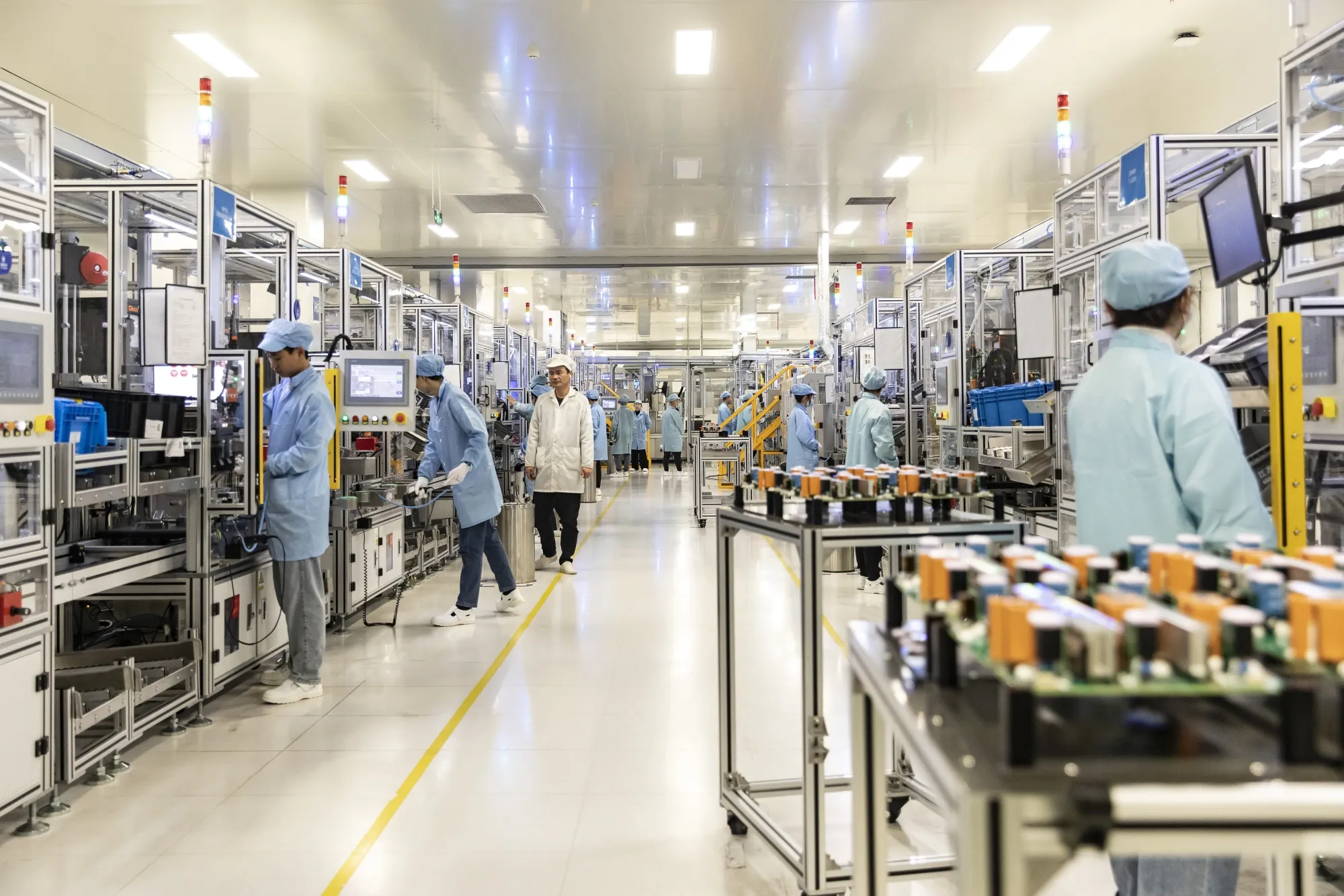 Workers on the production line of electric vehicle motors and drive control systems in Ningbo, China.