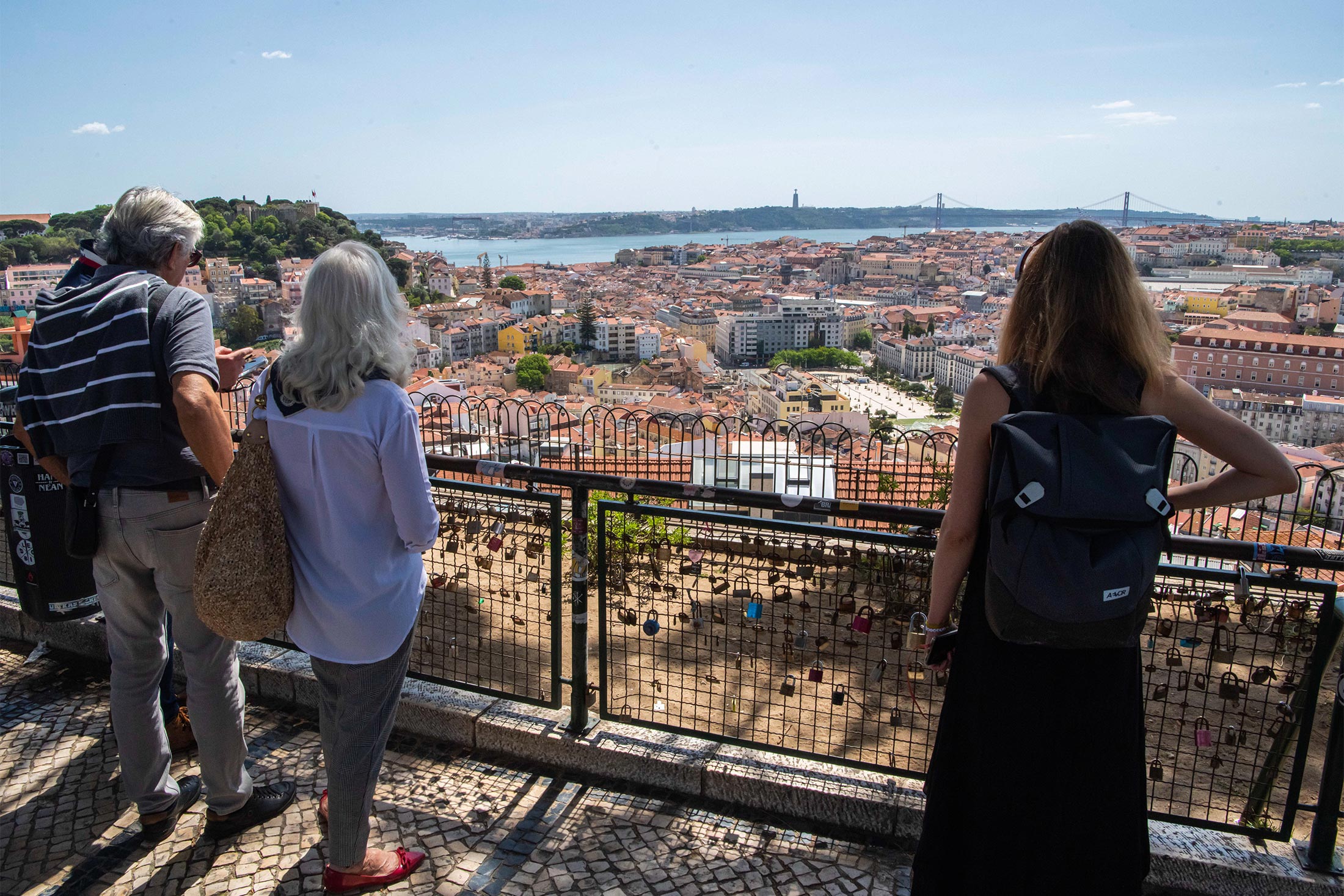People look at the city skyline in&nbsp;Lisbon, Portugal.