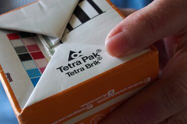 In this photo illustration, a dairy packaging is seen with