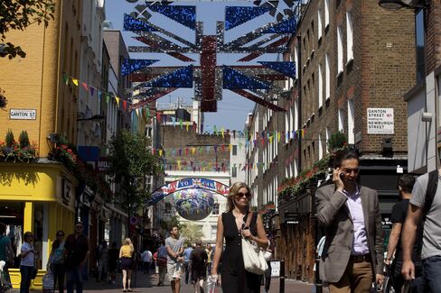 Pedestrians Pass Stores On Carnaby Street In London