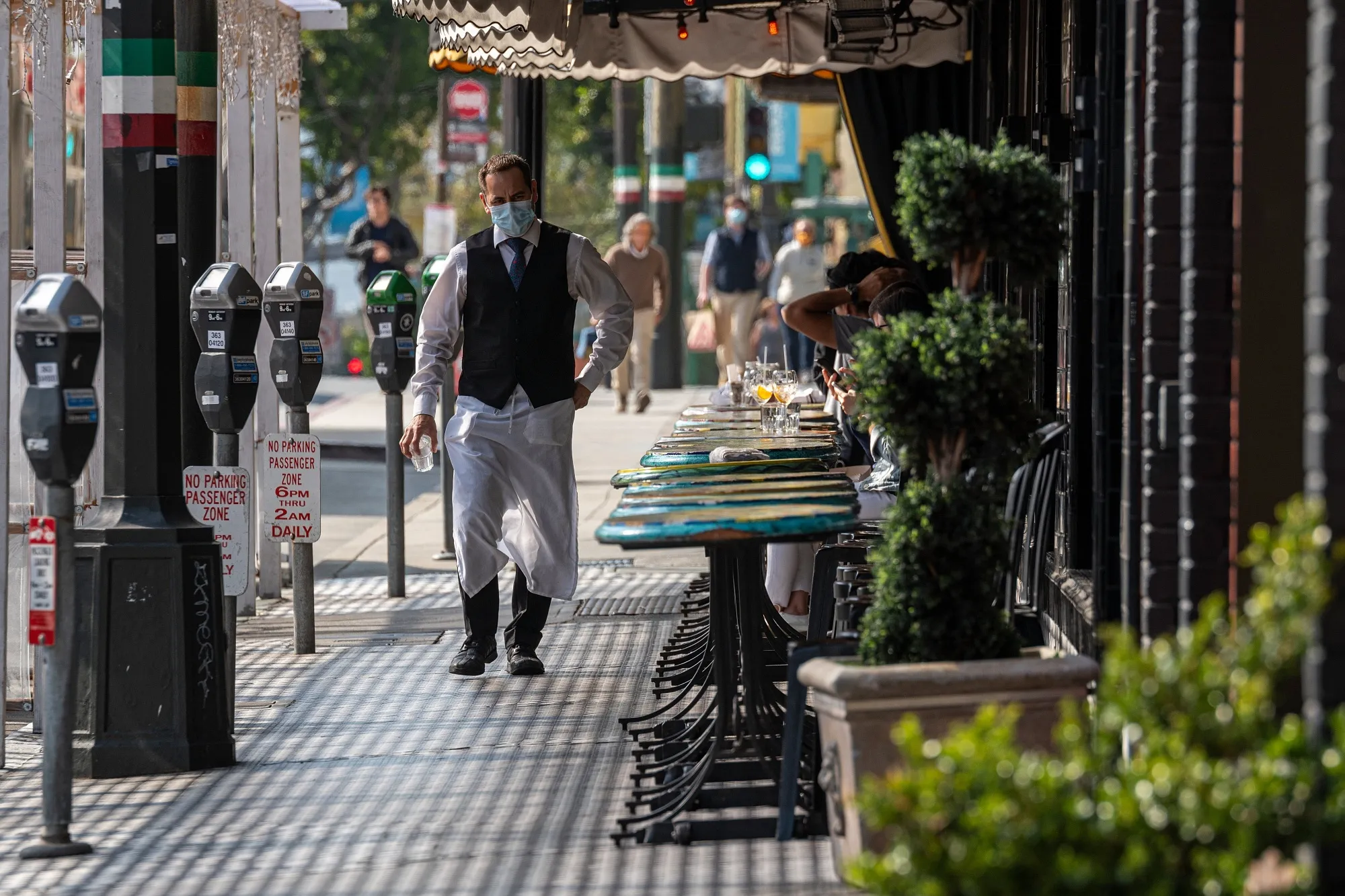 A server at a restaurant&nbsp;in San Francisco, California.